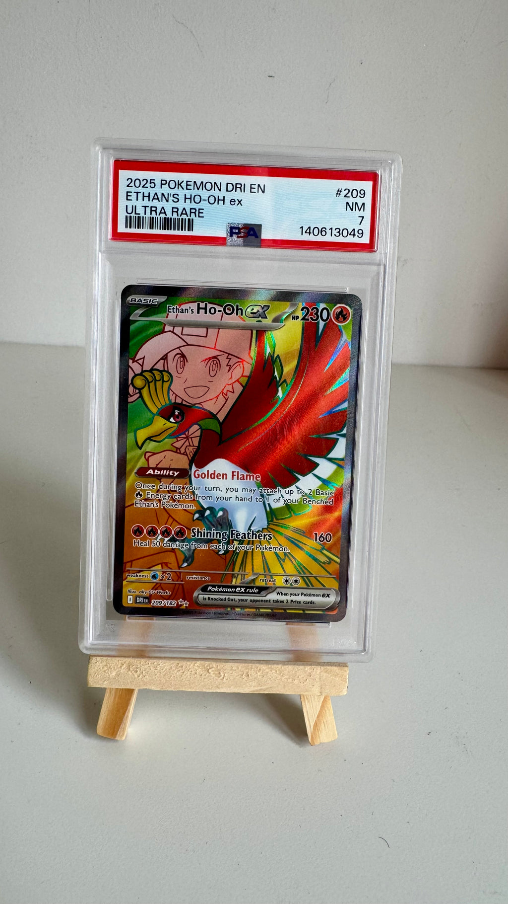 Ethan's Ho-Oh ex #209/182 - DRI Ultra Rare - PSA 7 NM - 2025 Pokémon